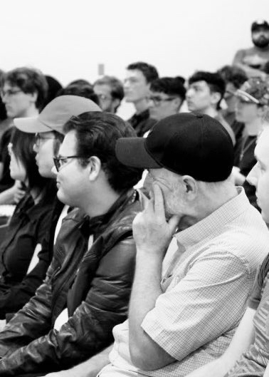 Image of faculty and students attending a seminar at The Democracy Institute