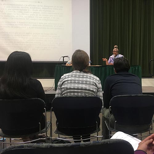 Artist Josefina Báez speaks at the event