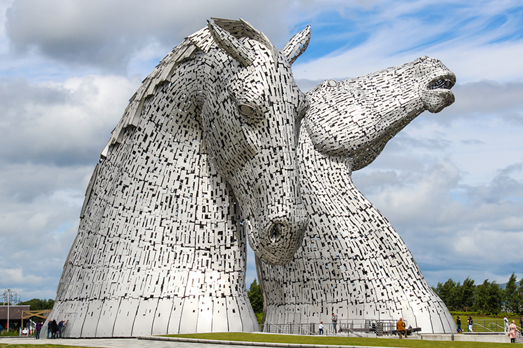 Two 30-meter high stainless steel horse head sculptures, "The Kelpies" by Andy Scott (2013) in Scotland. Photo by Mark Harkin.