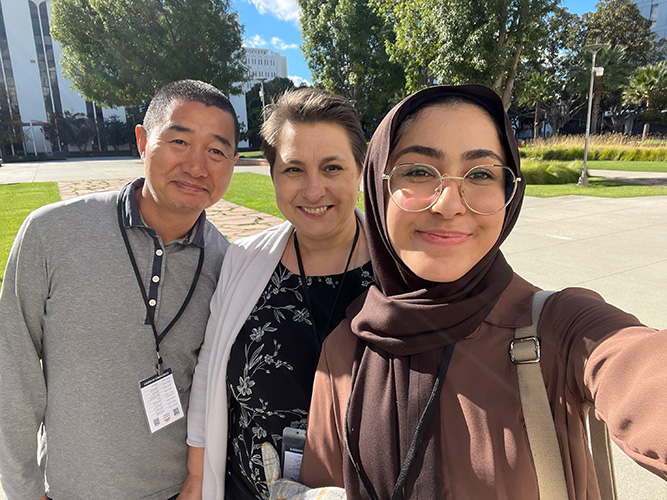 Xiaojun Mao, Olga Griswold & Mona Hassanzadeh smile together at CSU Fullerton