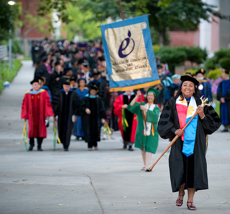 Professor Pacleb leading group of graduates