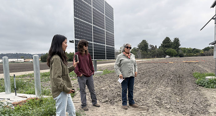 Students studying solar panels