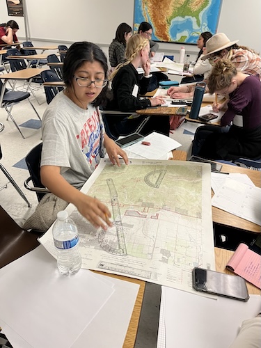 Student working with maps