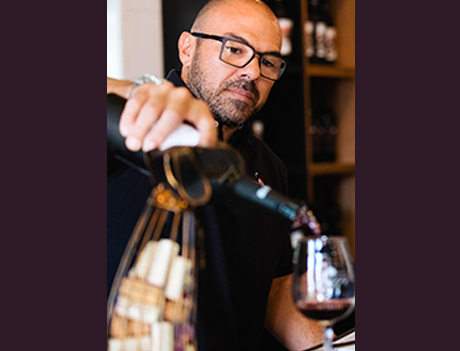 Damian Doffo pouring wine