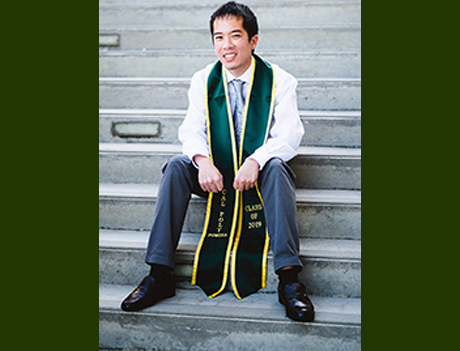 Eric Lee sitting on stairs 