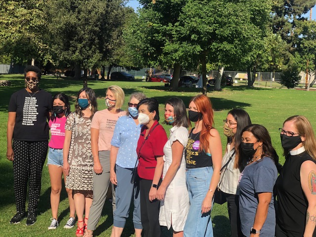 Caption: Professor Speak, fifth from left, at the Claremont Women's March on October 3, 2021. Also in the photo, Congress member Chu (sixth from left), and Congress member Torres, second from the right.