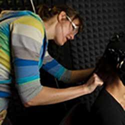 Dr. Rossi testing a participant with EEG