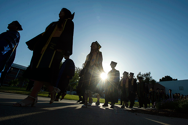 Students in cap and gown for graduation