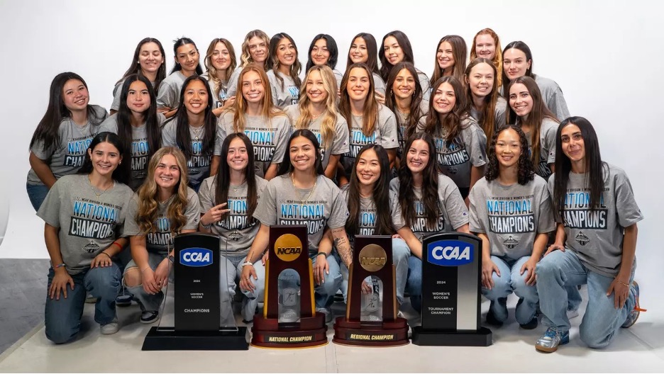 CPP soccer team group picture with trophies