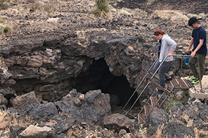 students heading to cave