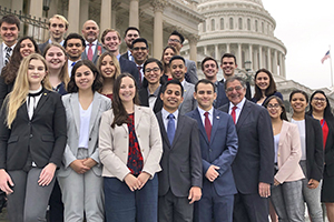 group of students with the State Capitol behind them