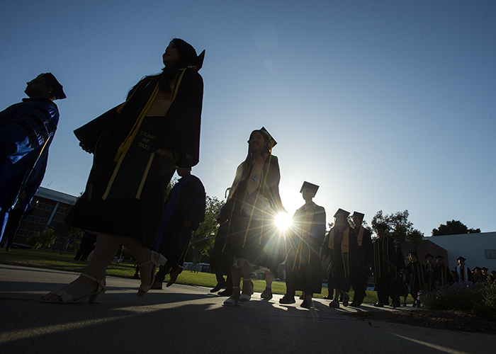 Grads walking in line