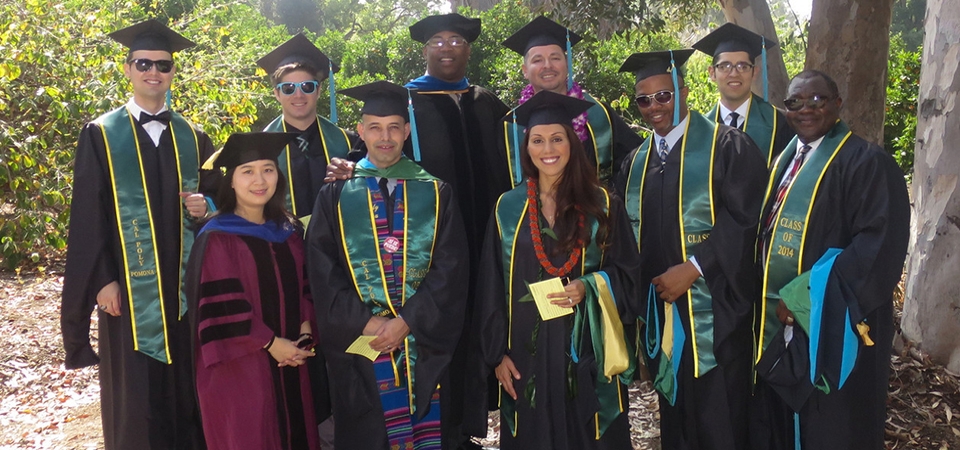Excited graduates with professors