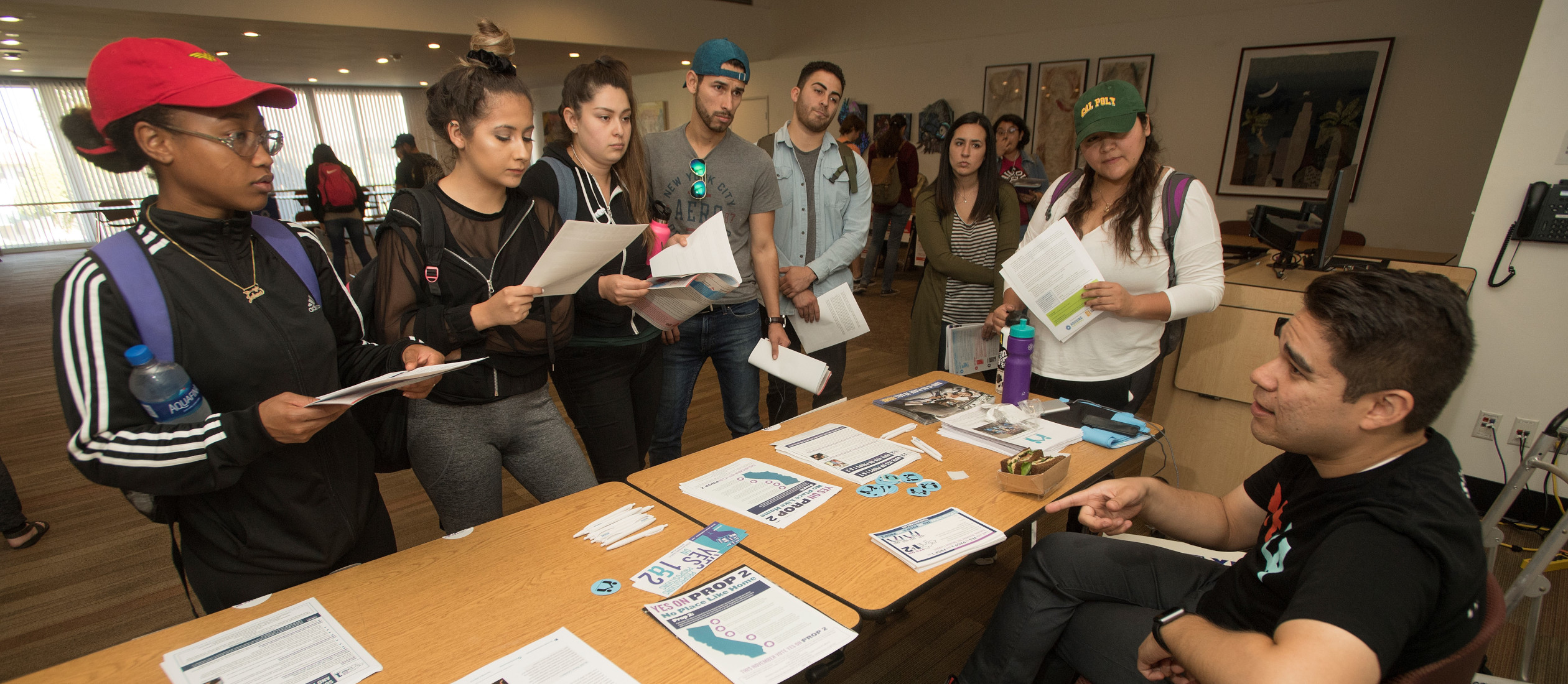 Students learn about ballot propositions 1 and 2 at the Election Fair