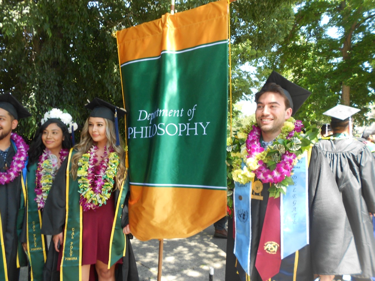 Photo of graduating philosophy majors Josh Ebiner, Valerie Felix, and Jasmine Diaz from spring 2018
