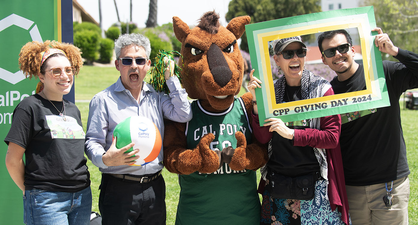 People pose with the Cal Poly Pomona mascot during CPP Giving Day 2024.