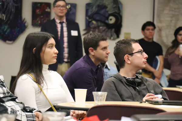 students actively listening with Philosopy Professor in the background