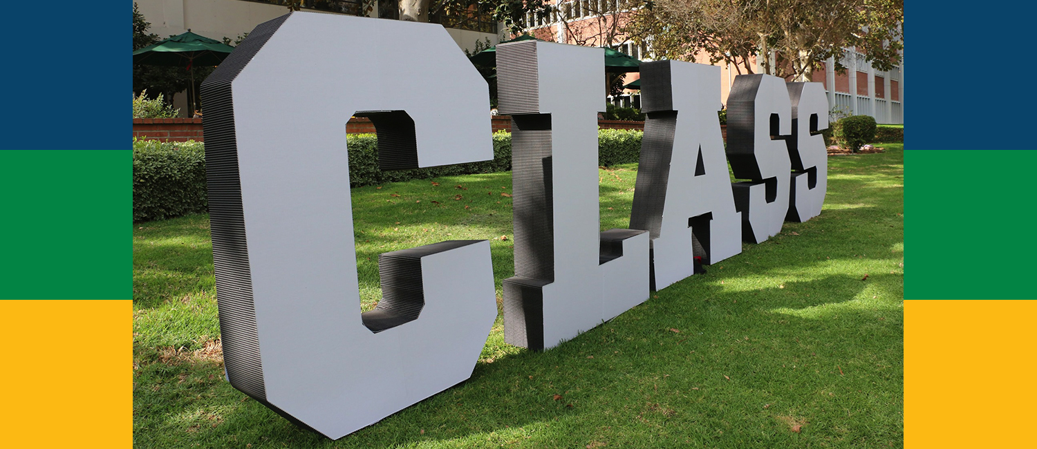 Large letters "CLASS" on grass in front of Building 5.