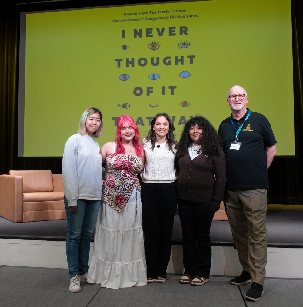 Contest winners on stage with Monica Guzman and Dr. Ben Dewald