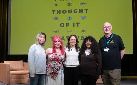 Photo of contest winners on stage with Monica Guzman and Dr. Ben Dewald