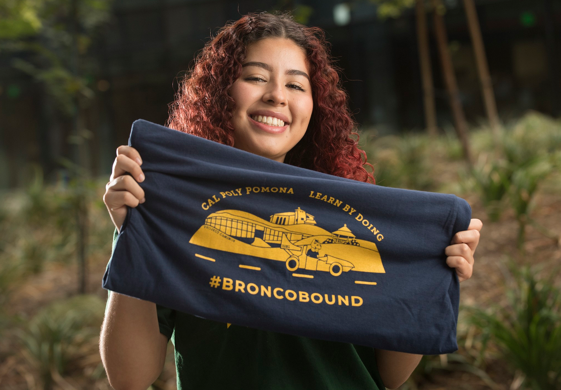 Student holding Bronco Bound shirt