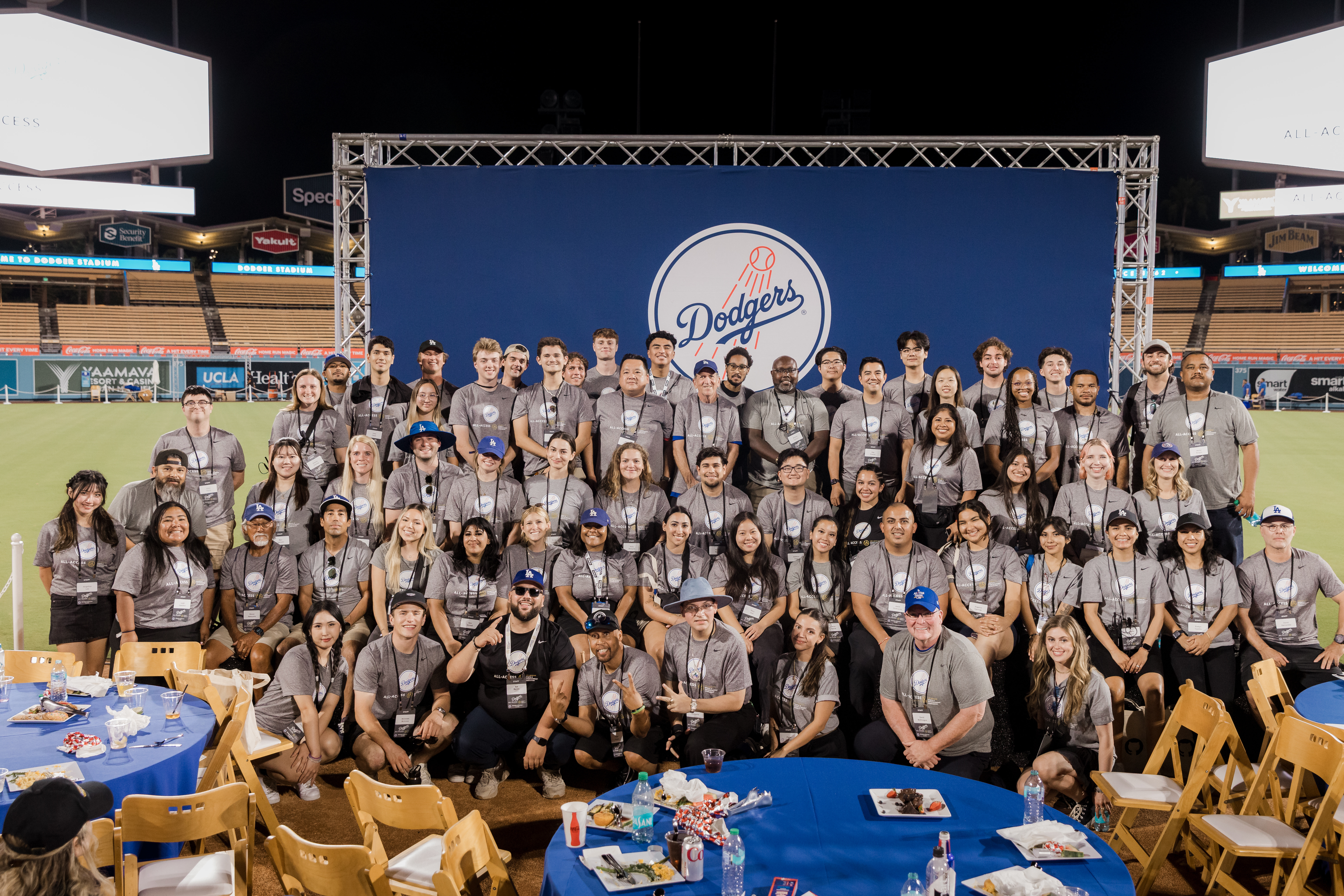 A group of hospitality management students at dodgers all-access posing for a photo.