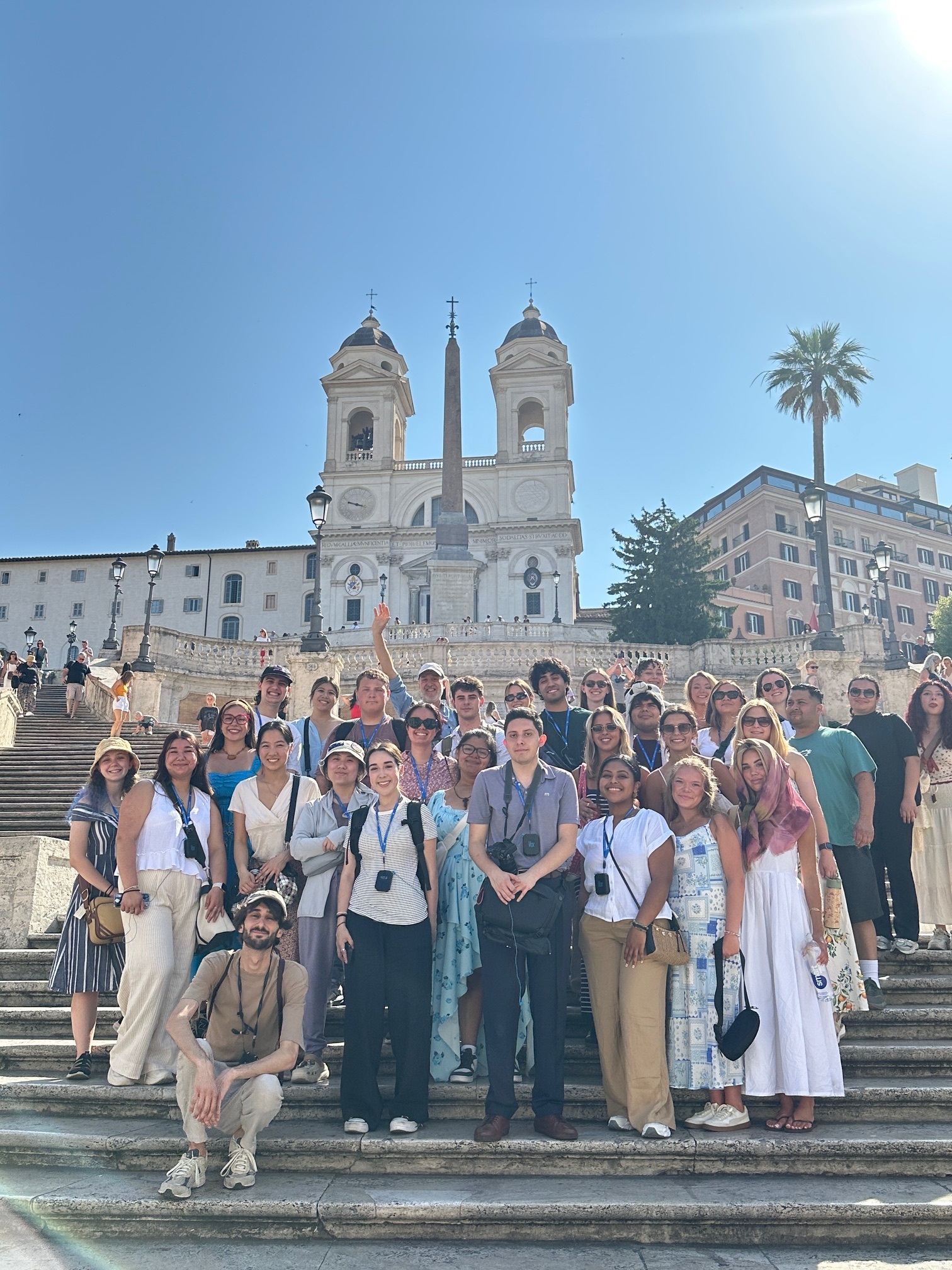A group of hospitality management students at posing for an outdoor photo in Italy.