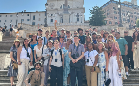 Group of hospitality management students taking a photo outdoors in Italy.
