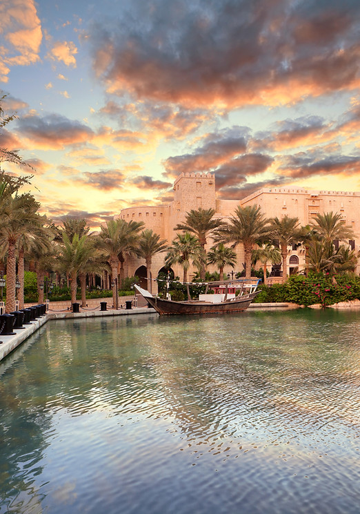 A hotel located next to a beach.
