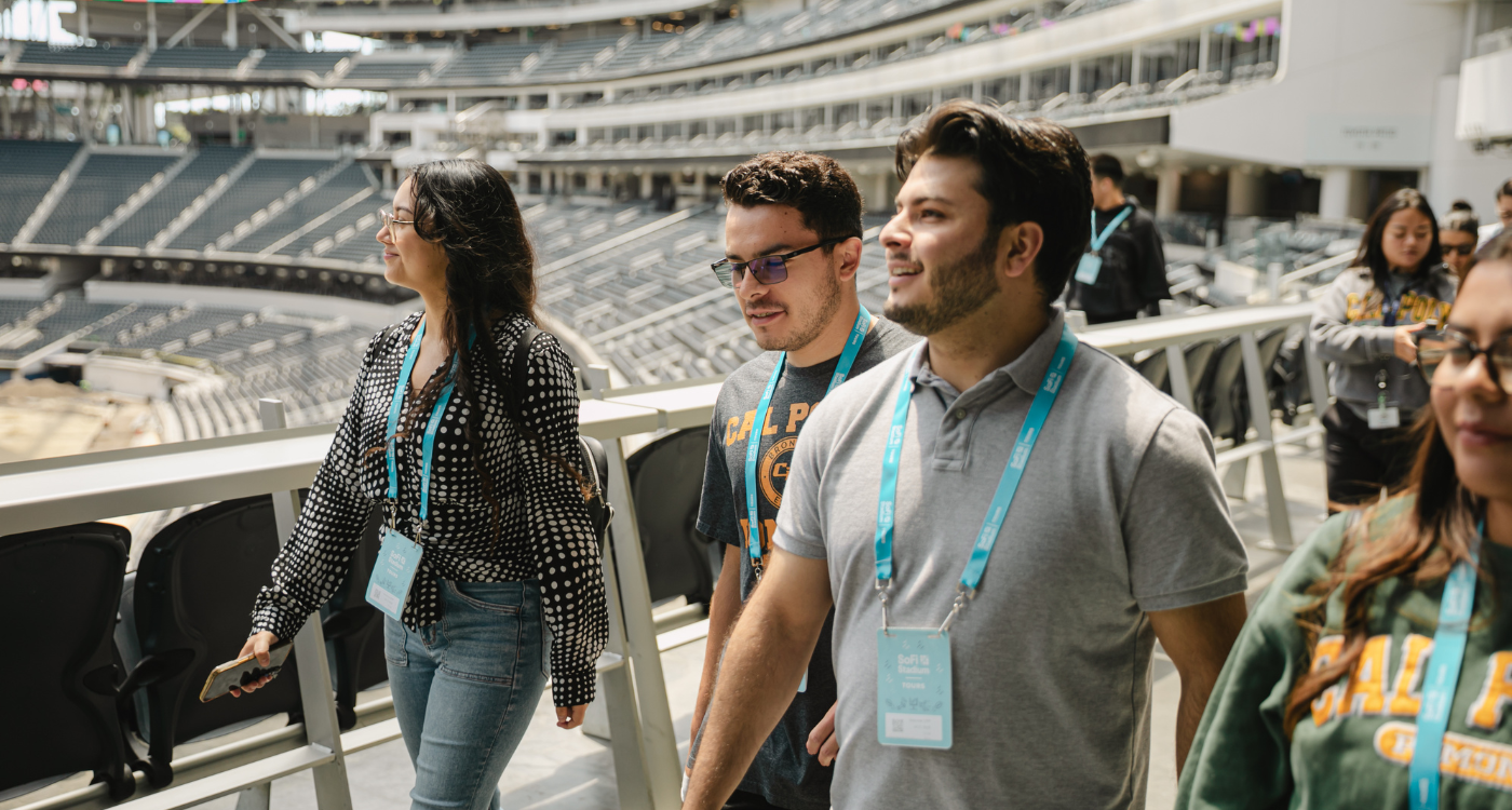 Students inside sofi stadium looking around