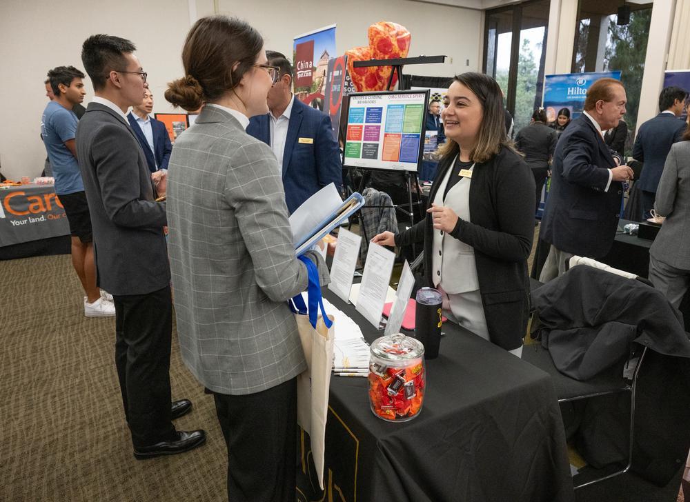 People talking inside career expo