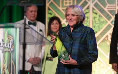 Debbie Harrison holding an award