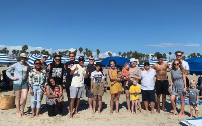 Group photo of alumni on the beach