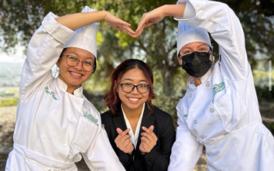 three culinary students posing for a photo