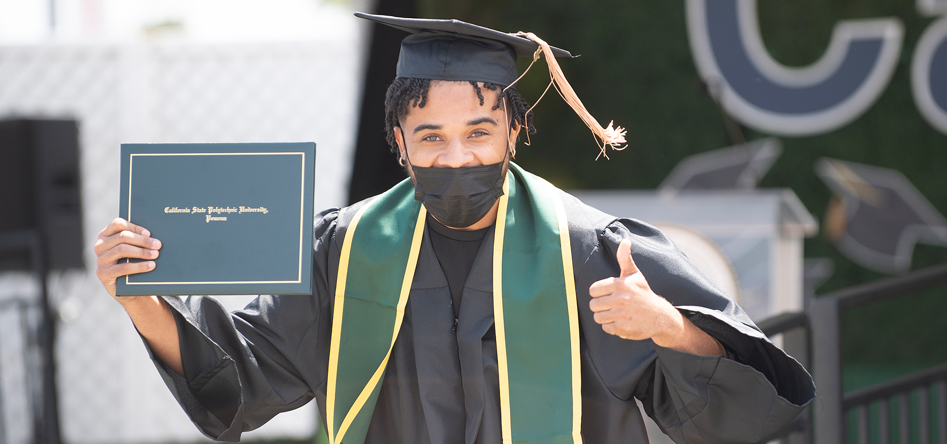 African American student celebrates after crossing the stage