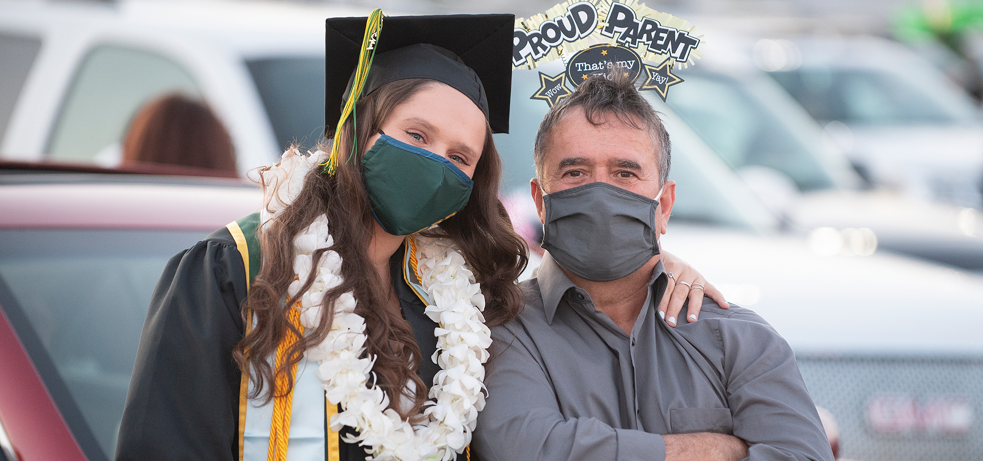 A CEIS grad poses with her father.