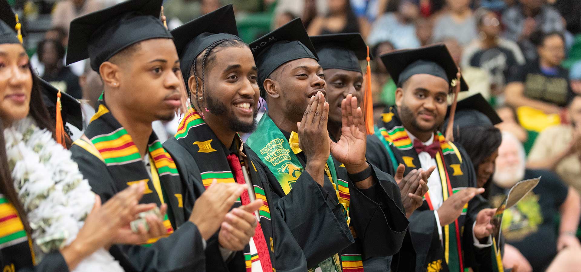 Male graduates celebrate during the 2023 Pan African celebration