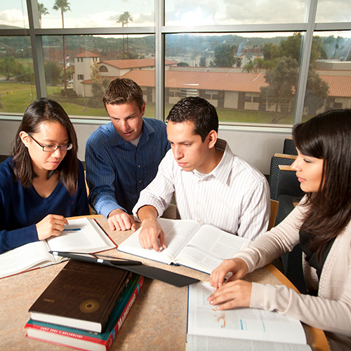 two people walking downstairs of federal building