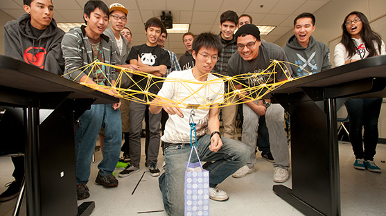 high school students building bridge