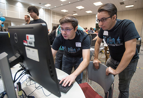 group of students looking at the computer