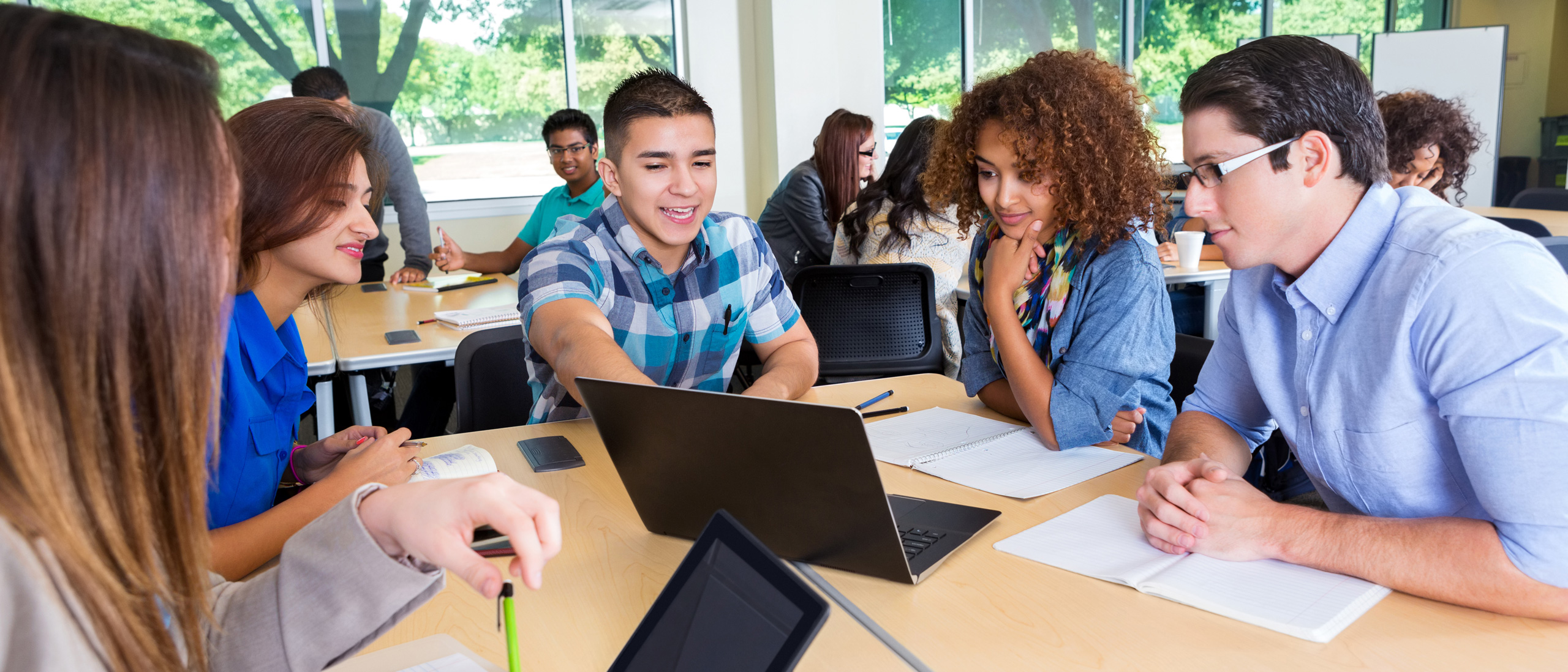 international students sitting around a desk