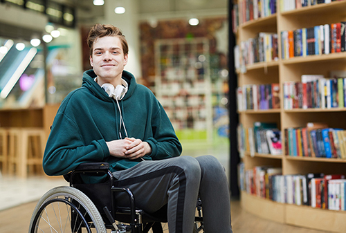 student in library