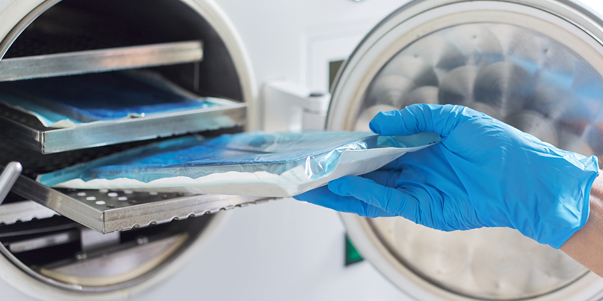 A hand holding a tray