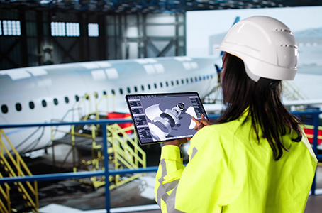 female aerospace engineer inspecting a plane
