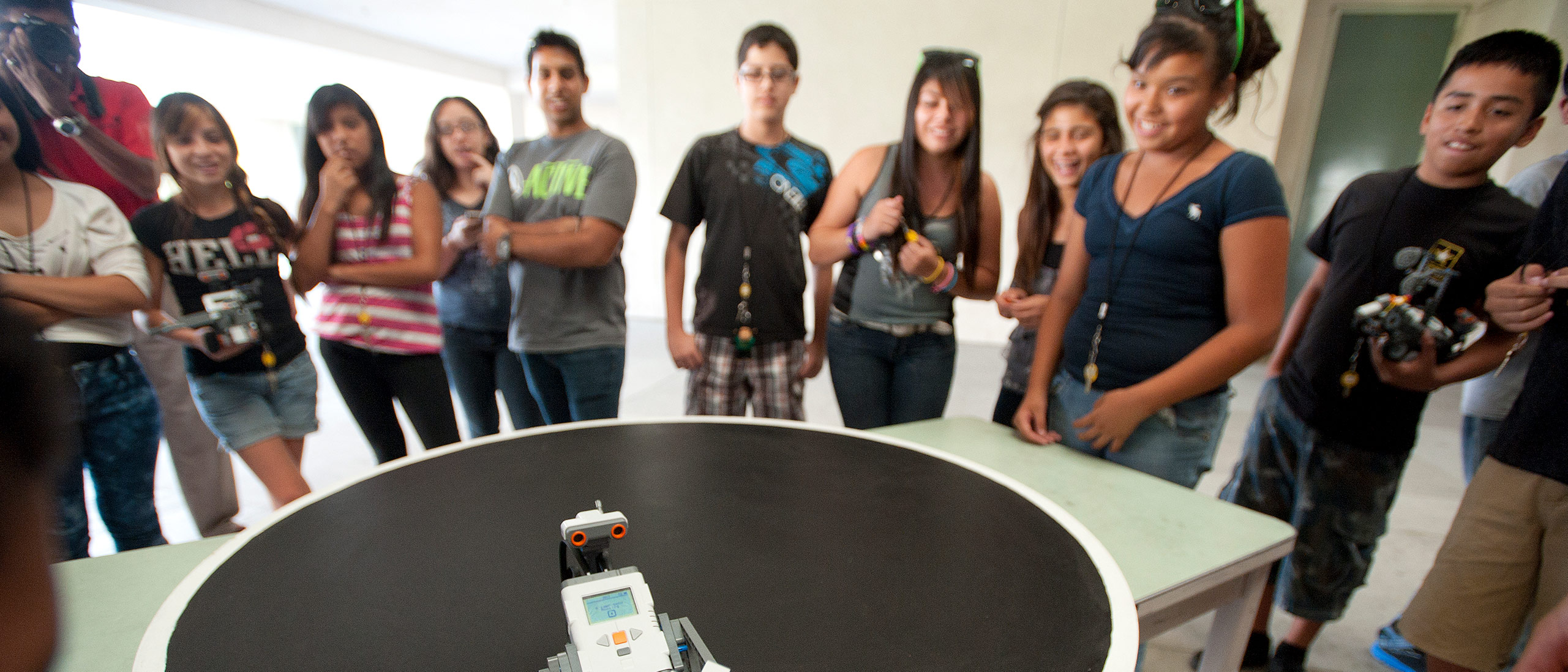 students watching robots