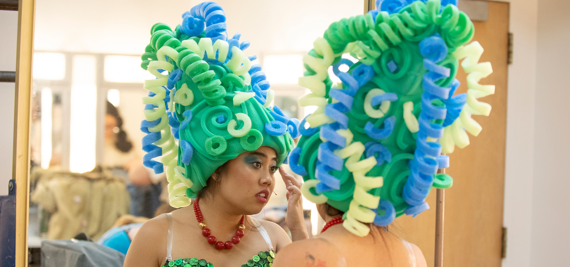 Marge Simpson checks her make up during dress rehearsal