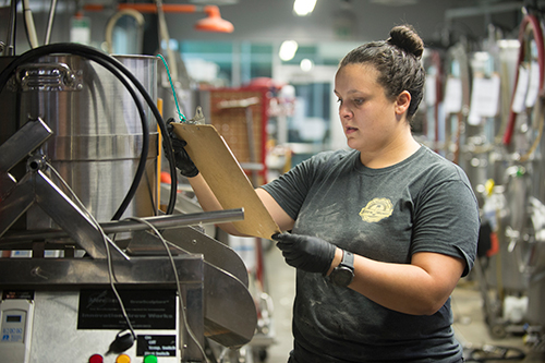 Stephanie Gebhardt checks the steps of beer