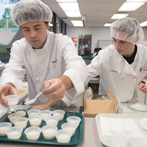 Students evaluate the taste, appearance and texture of the food products during taste testing.
