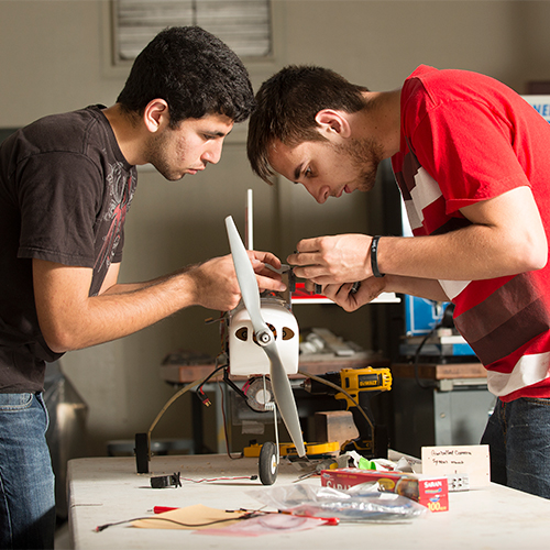 Two male students doing research for Northrup Grumman