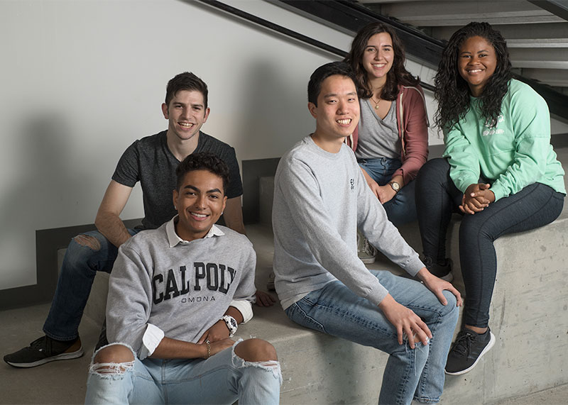 A group of diverse students smiling.